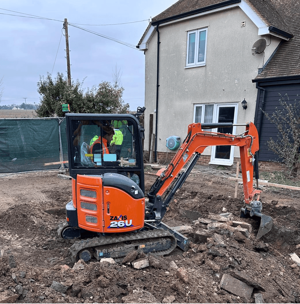 Mini Excavator Digging Foundation Trench